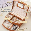 Porta-Jóias Maleta Compacto e Leve com alça de transporte, ideal para organizar e proteger suas joias em viagens. Design elegante e material de couro PU. Cabe facilmente em bolsas de mão