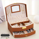 Porta-Jóias Maleta Compacto e Leve com alça de transporte, ideal para organizar e proteger suas joias em viagens. Design elegante e material de couro PU. Cabe facilmente em bolsas de mão